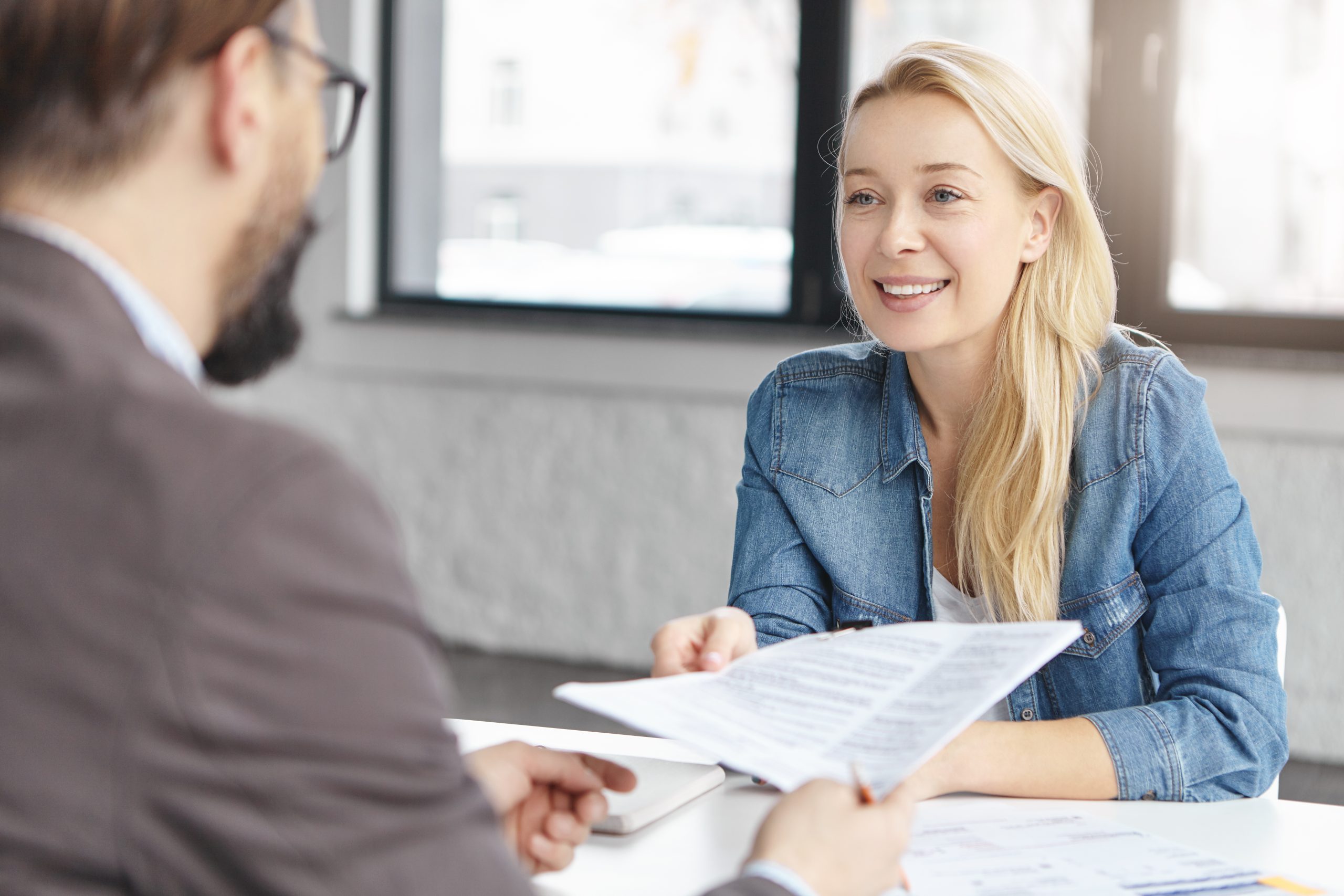 Employment solicitor reviewing a settlement agreement with a client